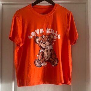 Vibrant Orange Short Sleeve Tee with Cartoon Graphic